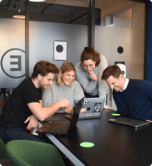 team happily sharing ideas