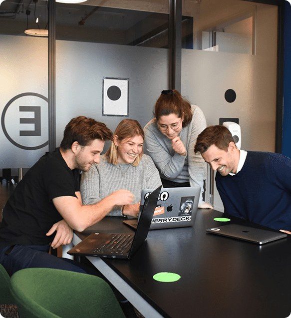 team happily sharing ideas